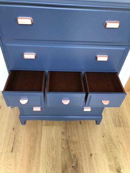 A pair of stag minstrel tallboy chest of drawers painted blue with copper handles – A rare vintage treasure