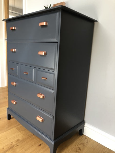 A pair of stag minstrel tallboy chest of drawers painted blue with copper handles – A rare vintage treasure