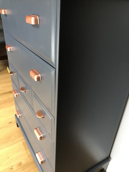 A pair of stag minstrel tallboy chest of drawers painted blue with copper handles – A rare vintage treasure