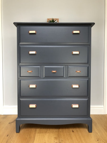 A pair of stag minstrel tallboy chest of drawers painted blue with copper handles – A rare vintage treasure