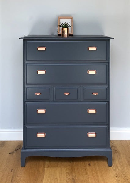 A pair of stag minstrel tallboy chest of drawers painted blue with copper handles – A rare vintage treasure