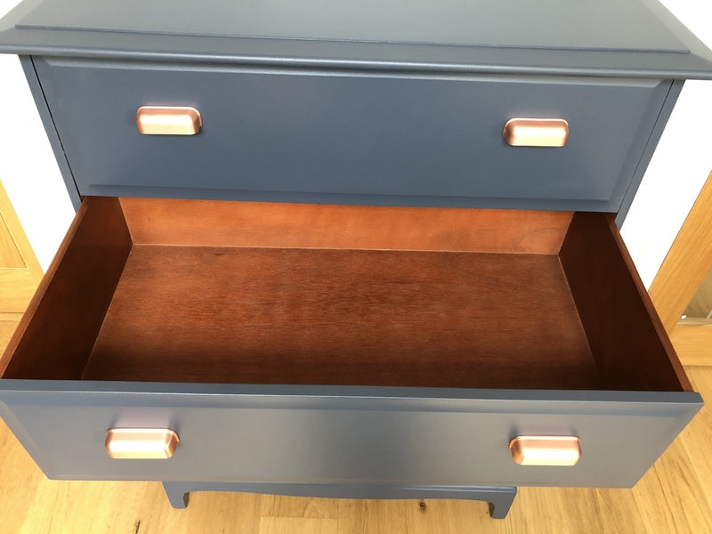 A pair of stag minstrel tallboy chest of drawers painted blue with copper handles – A rare vintage treasure